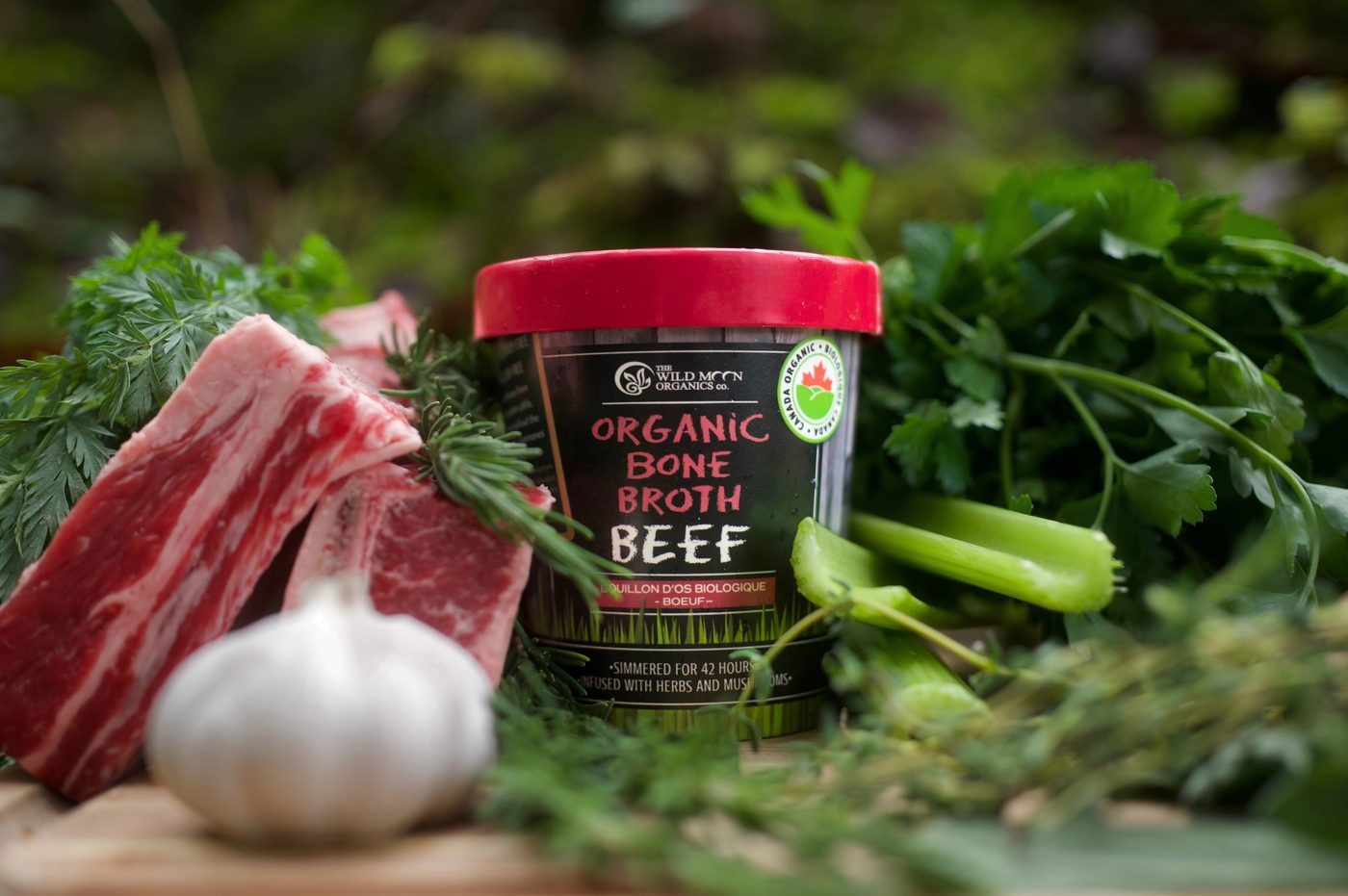 Organic beef bone broth with raw beef, garlic, and herbs